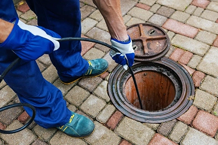 Licensed plumber clearing main sewer line